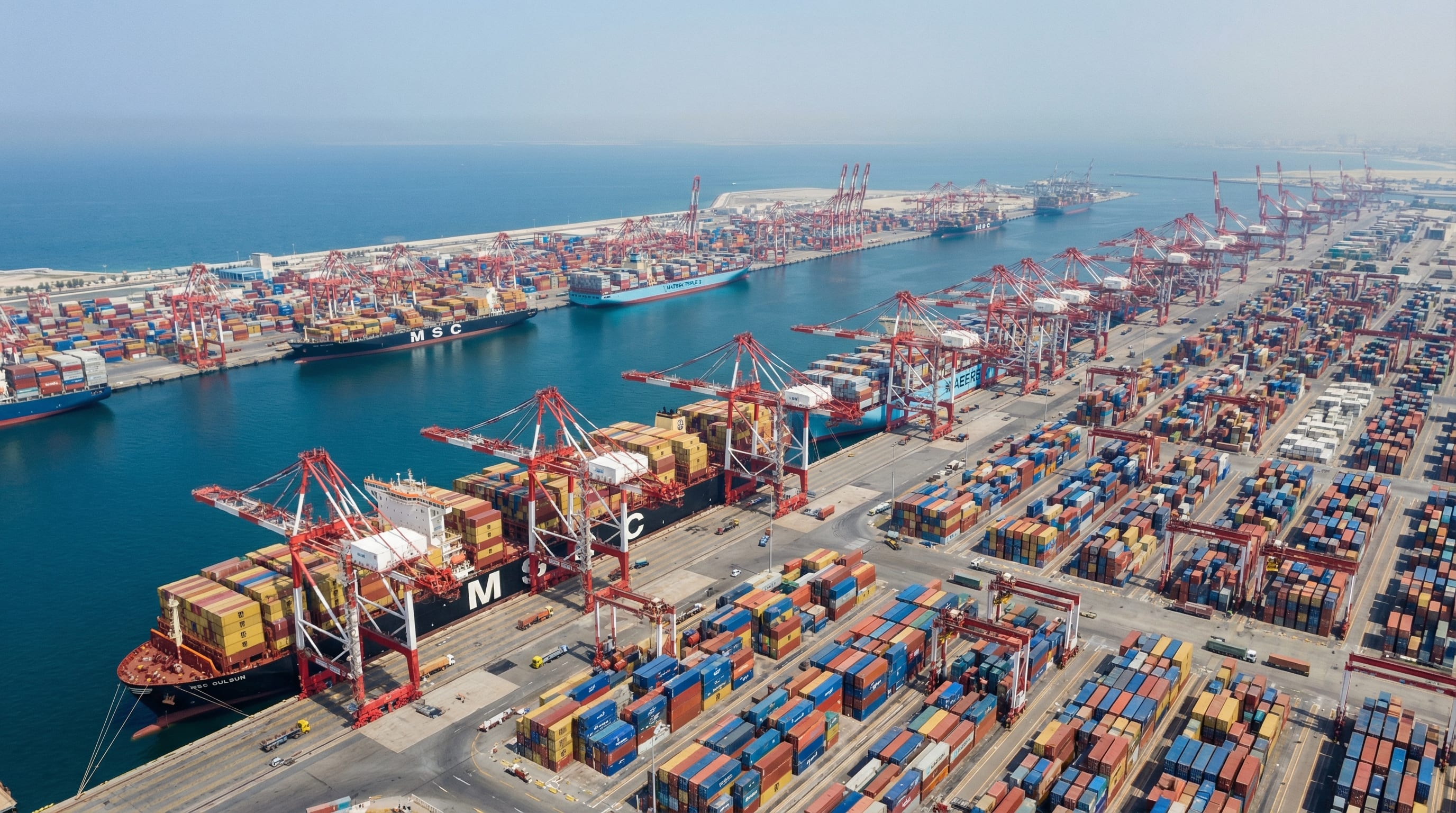 Aerial view of a major UAE port facility handling container cargo for 3PL logistics operations
