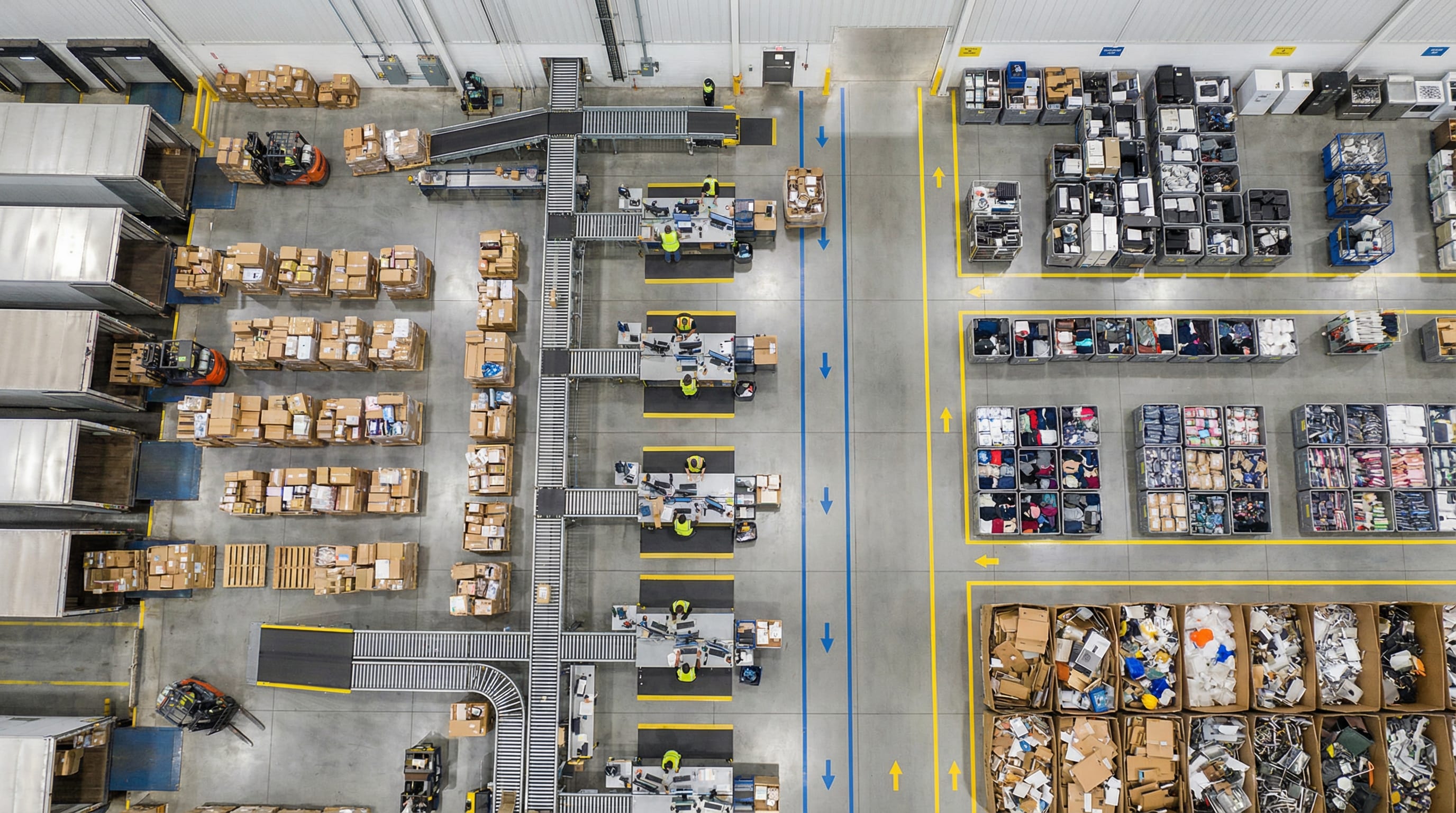 Aerial view of a large returns processing facility with organized zones for sorting, refurbishment, and redistribution